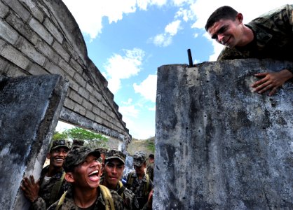 US Navy 110315-N-EC642-126 Staff Sgt. Daniel Monteiro, assigned to Marine Corps Training and Advisory Group, demonstrates proper wall climbing tech photo