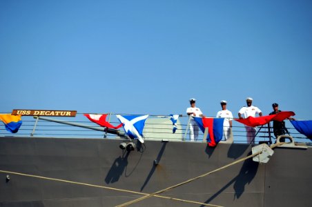 US Navy 110316-N-9818V-386 Chief Fire Controlman Seth Rusackas, left, Chief Gunner's Mate Rico Barkell, Lt. Dornelieo Waits and Yeoman 3rd Class Pa