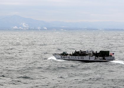 US Navy 110319-N-4743B-062 A landing craft utility from the forward-deployed amphibious assault ship USS Essex (LHD 2) is underway off the coast of