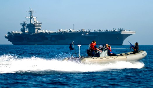 US Navy 110317-N-6320L-744 Sailors assigned to the Nimitz-class aircraft carrier USS Carl Vinson (CVN 70) maneuver a rigid-hull inflatable boat whi