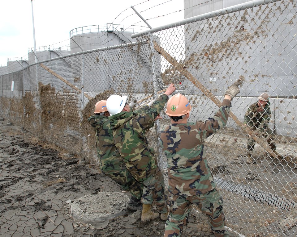 US Navy 110315-N-ZI955-086 Seabees assigned to Naval Facilities Engineering Command Far East, Det. Misawa, reinforce the fence line at Fleet and In