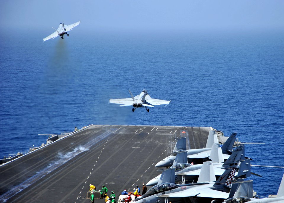 US Navy 110317-N-0569K-004 F-A-18F Super Hornets assigned to Carrier Air Wing (CVW) 1 launch from the aircraft carrier USS Enterprise (CVN 65)