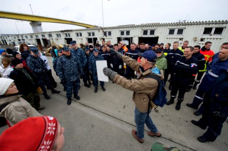 US Navy 110321-N-9436A-006 Local Misawa translator Simon Bernard briefs volunteers before beginning relief efforts