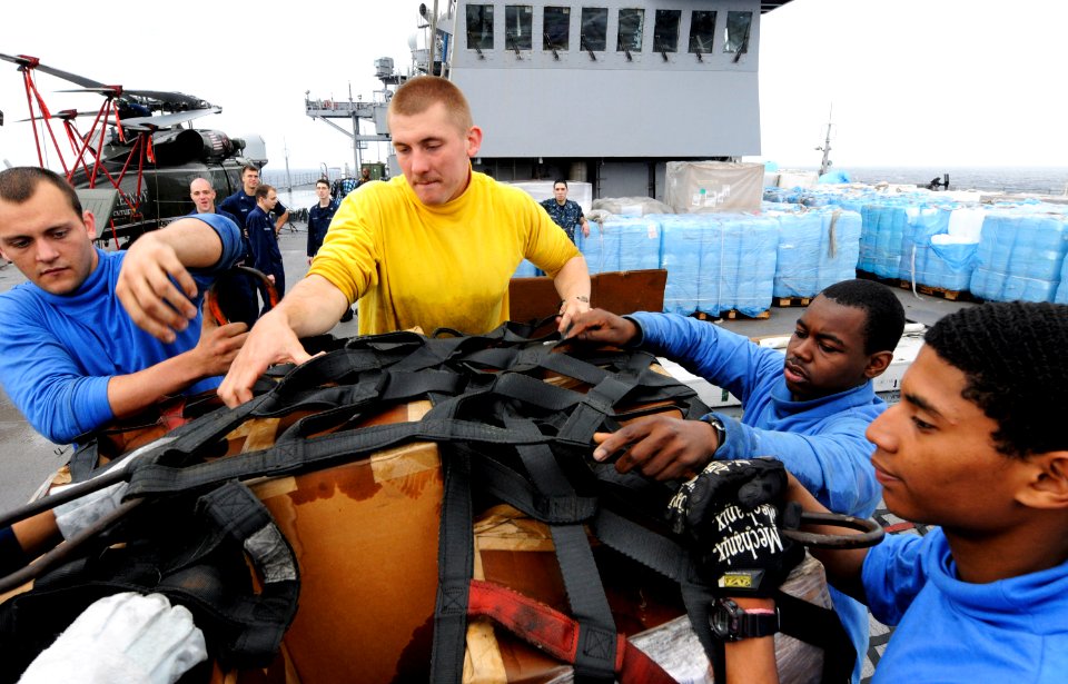 US Navy 110320-N-5716H-203 Seaman Kameron Maison, left, Culinary Specialist 3rd Class Drew Iverson, Aviation Ordnanceman Airman Brandon Frasier and