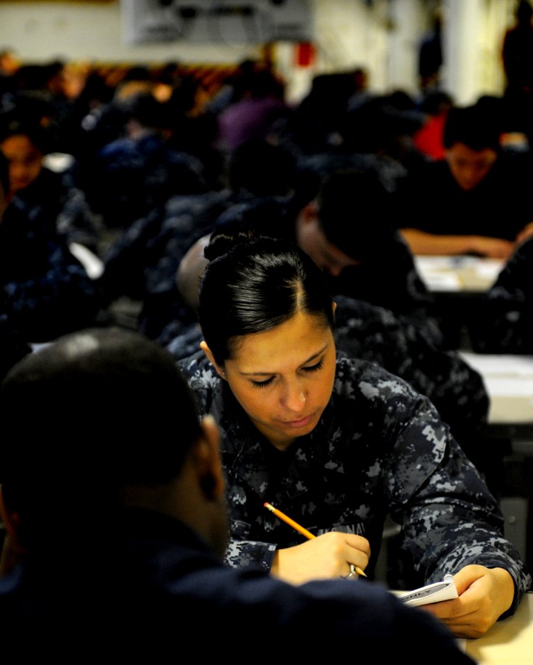 US Navy 110317-N-8040H-013 Ship's Serviceman Seaman Shanna Larios takes the E-4 advancement exam on the aft mess decks aboard the Nimitz-class air
