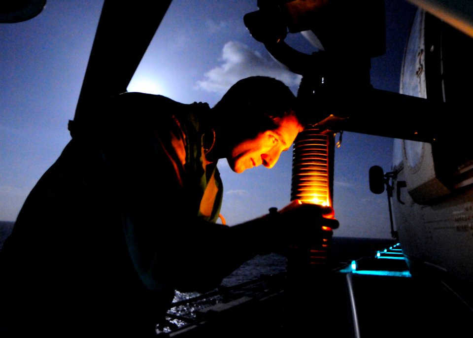 US Navy 110319-N-3154P-193 Naval Air Crewman 2nd Class Jordan Orr, assigned to Helicopter Sea Combat Squadron (HSC) 22, checks the mount for a GAL
