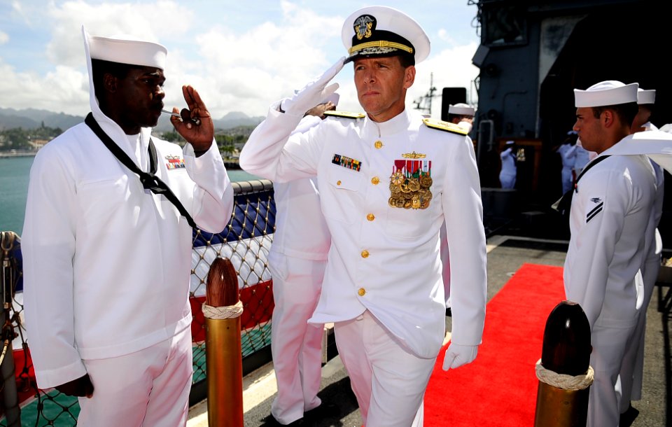 US Navy 110317-N-WP746-247 Rear Adm. Dixon Smith, commander of Naval Surface Group, Middle Pacific, salutes as he exits a change of command ceremon