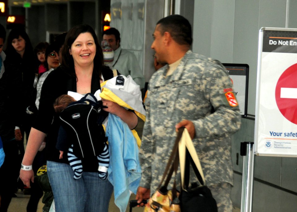 US Navy 110321-N-AE328-008 More than 120 family members who arrived at Seattle Tacoma International Airport (SEATAC) from Japan as part of Operatio