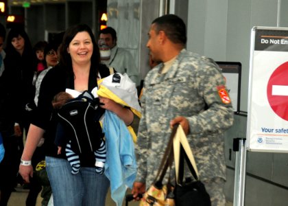 US Navy 110321-N-AE328-008 More than 120 family members who arrived at Seattle Tacoma International Airport (SEATAC) from Japan as part of Operatio