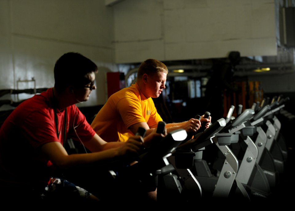 US Navy 110322-N-YZ751-034 Aircrew Survival Equipmentman 3rd Class Justin Drey works out to prepare for an upcoming physical fitness assessment