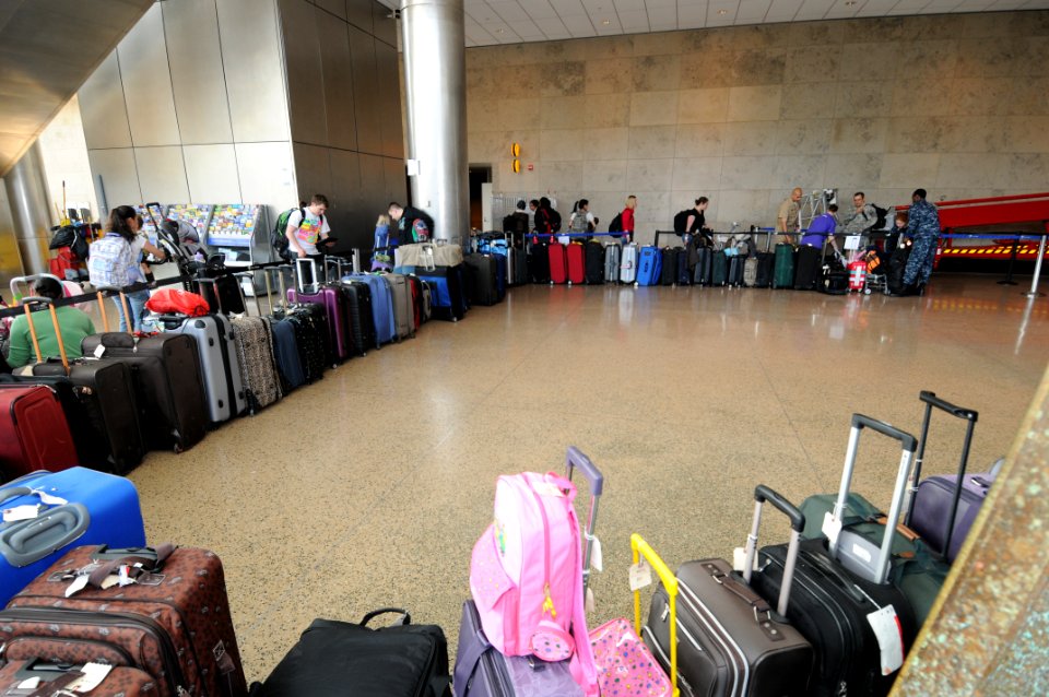 US Navy 110322-N-AE328-011 Luggage starts to pile up as military family members arriving at Seattle Tacoma International Airport from Japan begin t