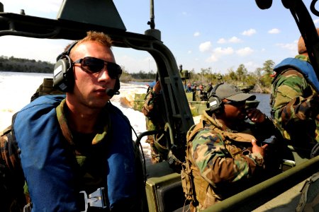 US Navy 110322-N-YO394-344 Boatswain's Mate 2nd Class Shawn Graham, right, assigned to Riverine Squadron (RIVRON) 3,