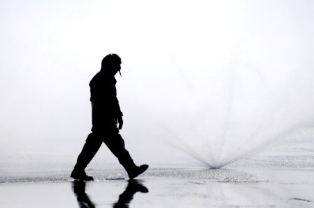 US Navy 110323-N-IC111-913 Aviation Boatswain's Mate (Handler) 3rd Class Emmanuel Gedeon, from Miami, checks sprinklers during a countermeasure was