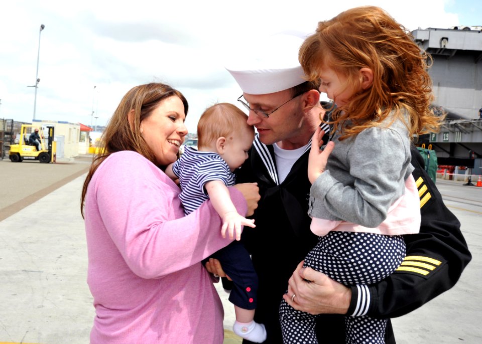 US Navy 110319-N-YB753-057 Electronics Technician 1st Class Eric Champlin, from Silverwood, Mich., holds his newborn daughter for the first time up