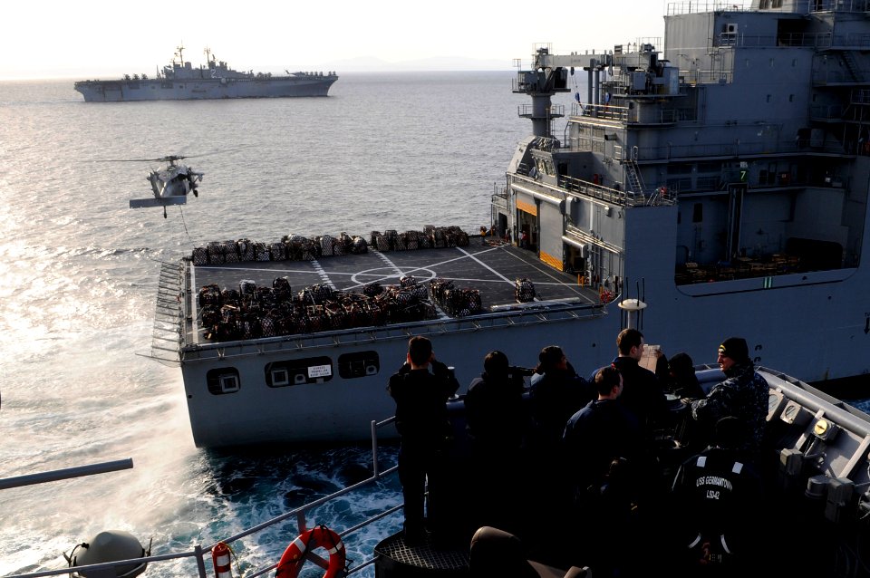US Navy 110321-N-6692A-118 Sailors stand watch on the port bridge wing aboard the amphibious dock landing ship USS Germantown (LSD 42) during an un