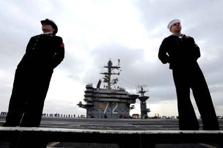 US Navy 110319-N-ZL940-097 Sailors assigned to the aircraft carrier USS Abraham Lincoln (CVN 72) man the rails as the ship pulls into San Diego photo