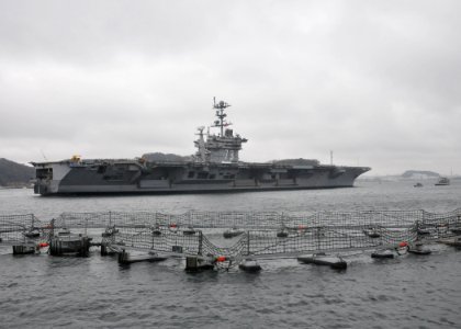 US Navy 110321-N-IO627-047 The forward-deployed aircraft carrier USS George Washington (CVN 73) departs Commander Fleet Activities Yokosuka