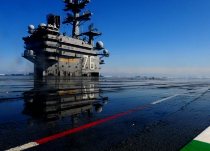 US Navy 110323-N-UO379-192 Saltwater pools on the flight deck of the aircraft carrier USS Ronald Reagan (CVN 76) during a countermeasure wash down