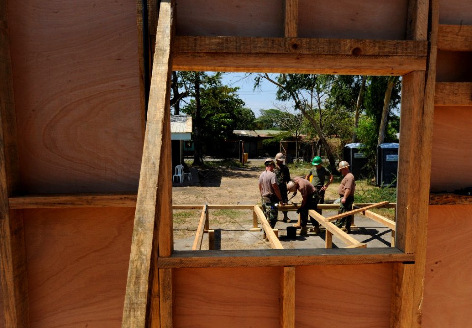 US Navy 110323-N-WX845-129 Sailors assigned to Naval Mobile Construction Battalion (NMCB) 28 construct the foundation for a Southeast Asia hut at I
