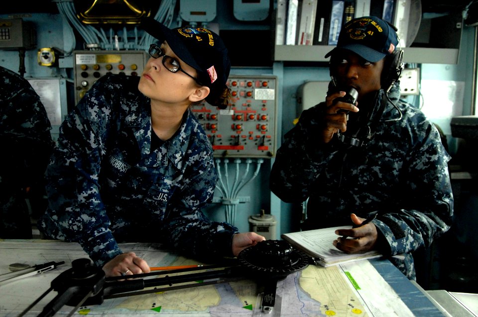 US Navy 110323-N-QP268-041 Sailors stand by for orders as the amphibious dock landing ship USS Whidbey Island (LSD 41) departs Joint Expeditionary