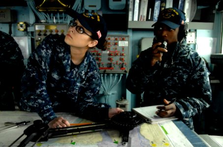 US Navy 110323-N-QP268-041 Sailors stand by for orders as the amphibious dock landing ship USS Whidbey Island (LSD 41) departs Joint Expeditionary