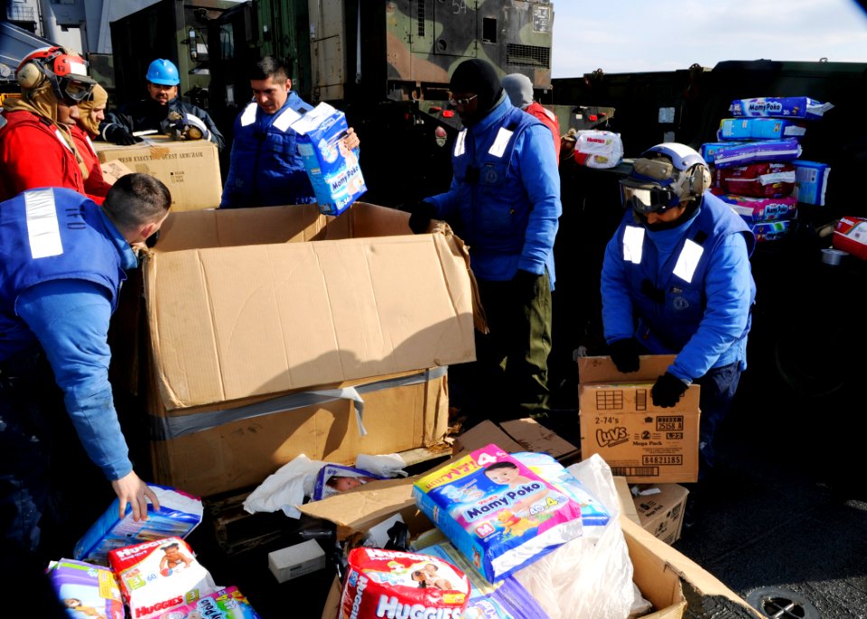 US Navy 110324-N-6692A-033 Sailors prepare relief supplies. Germantown is off the coast of Japan providing humanitarian assistance as directed in s