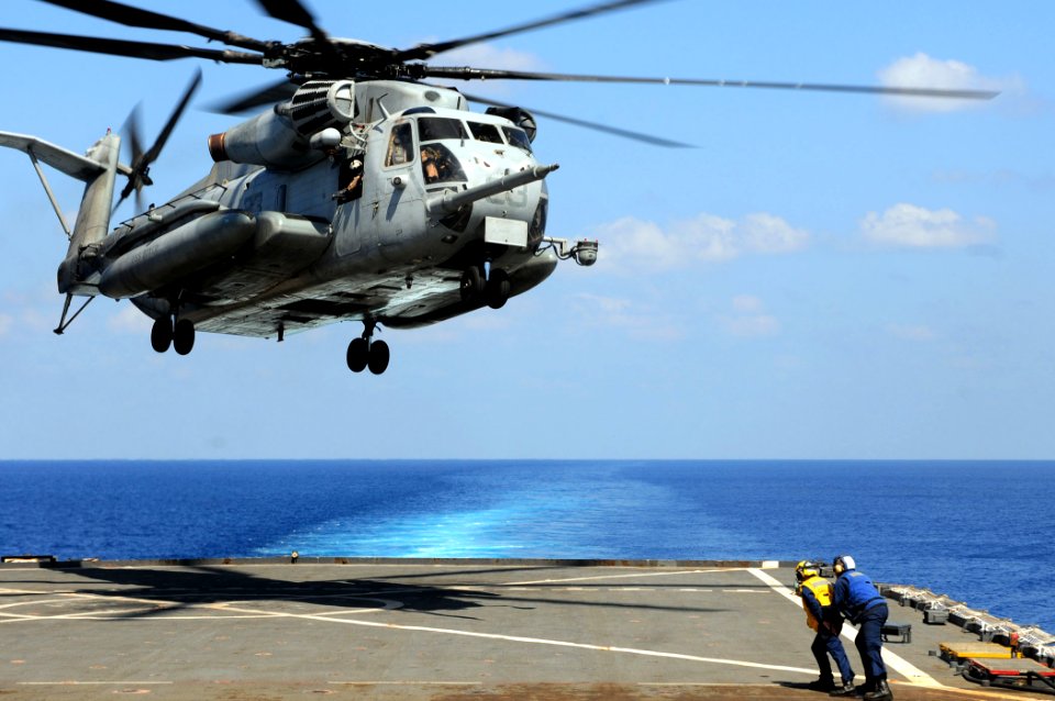 US Navy 110326-N-RC734-443 A CH-53E Super Stallion helicopter lifts off from USS Comstock (LSD 45) during deck landing qualifications