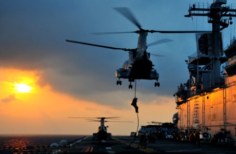 US Navy 110324-N-ZS026-296 Marines assigned to the 13th Marine Expeditionary Unit (13th MEU) drops from a CH-46 Sea Knight helicopter