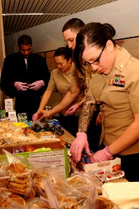 US Navy 110324-N-BS576-015 Sailors assigned to the aircraft carrier USS Nimitz (CVN 68) organize snacks and refreshments for active-duty