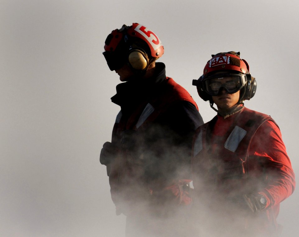 US Navy 110326-N-6505H-257 Aviation ordnancemen work on the flight deck of the Nimitz-class aircraft carrier USS Carl Vinson (CVN 70)