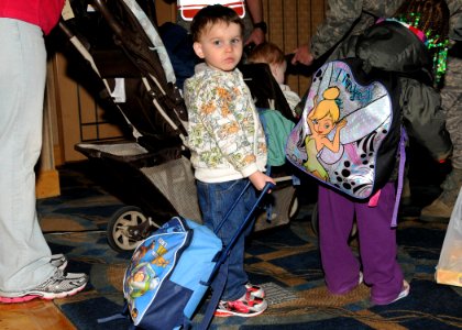 US Navy 110322-N-VA590-072 A family prepares for their voluntary departure to the continental U.S. as part of Operation Pacific Passage