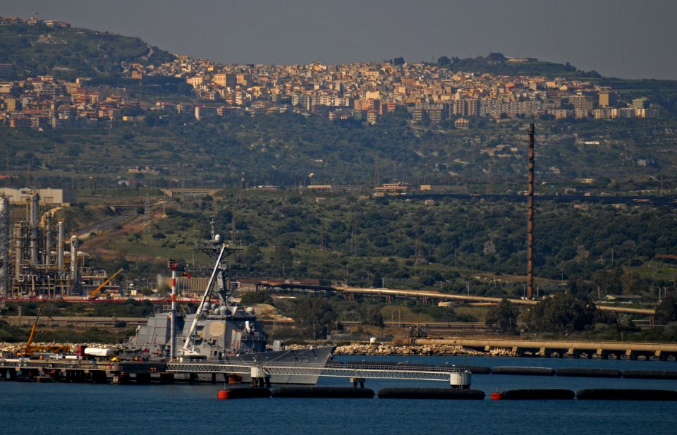 US Navy 110324-N-AQ172-042 The Arleigh-Burke class guided-missile destroyer USS Stout (DDG 55) is pierside in Augusta Bay loading supplies in suppo