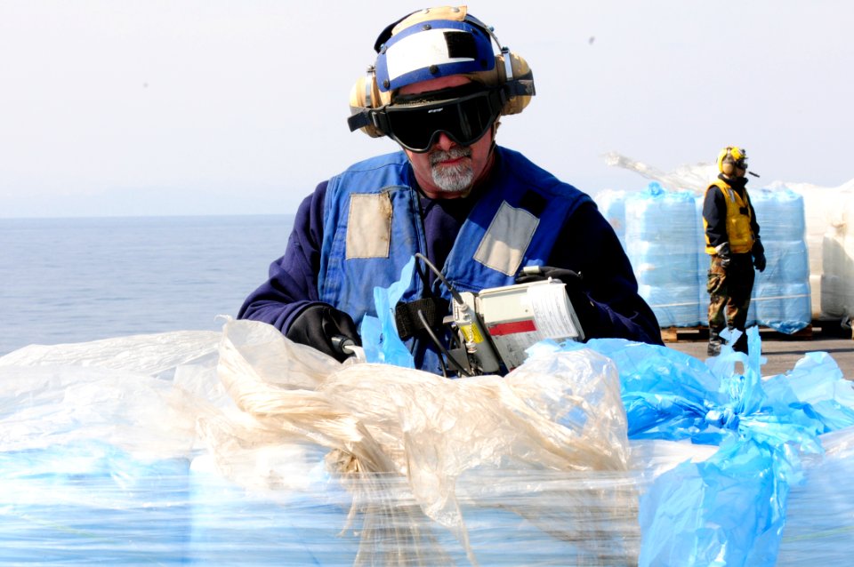 US Navy 110325-N-4920H-103 Radiological physical science technician Mark O'Conner uses a IM-265 radiacmeter to scan humanitarian assistance supplie