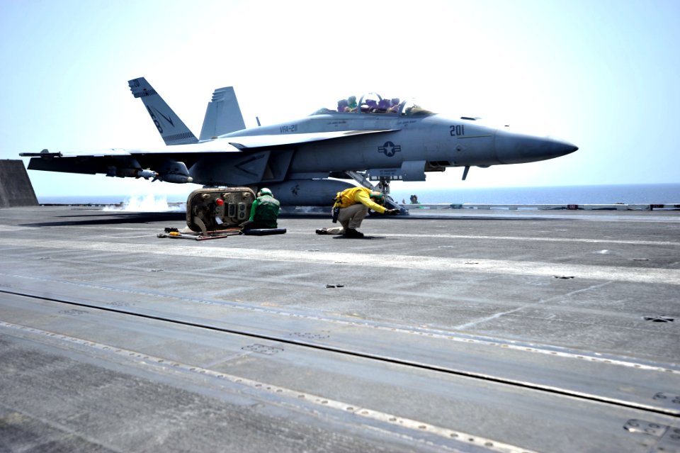 US Navy 110328-N-0569K-072 A shooter gives the launch signal to an F-A-18F Super Hornet aboard USS Enterprise (CVN 65)