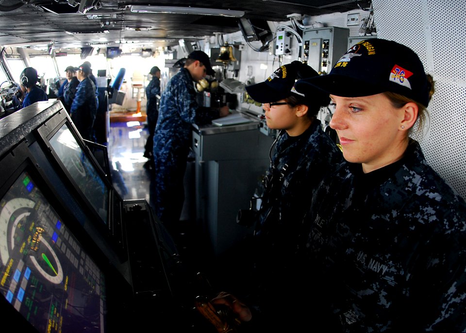US Navy 110329-N-SB672-010 Seaman Jennifer Boyle, from Spokane, Wash., mans the helm aboard the aircraft carrier USS Ronald Reagan (CVN 76)