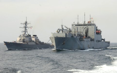 US Navy 110324-N-8288P-467 Military Sealift Command auxiliary dry cargo ship USNS Carl Brashear (T-AKE 7) pulls alongside the Arleigh Burke-class g
