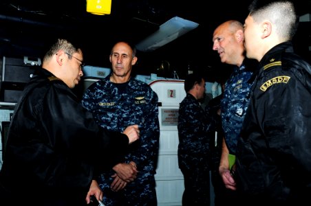 US Navy 110330-N-IC111-031 Vice Adm. Scott Van Buskirk, commander of U.S. 7th Fleet, speaks with members of the Japan Maritime Self-Defense Force a