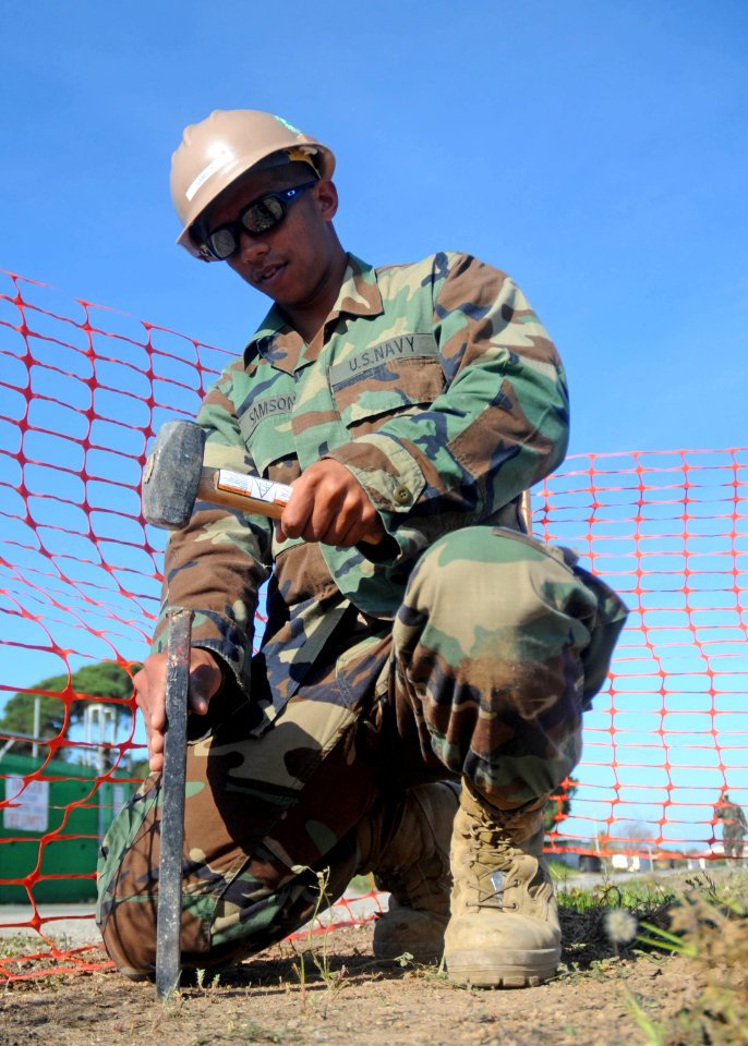 US Navy 110330-N-AW868-060 Engineering Aid Jonathanjan Samson, assigned to the engineering department of Naval Mobile Construction Battalion (NMCB)
