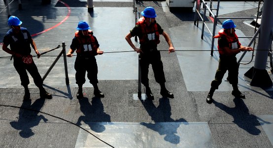 US Navy 110324-N-RC734-067 Sailors man the phone and distance line aboard the amphibious dock landing ship USS Comstock (LSD 45) during an underway