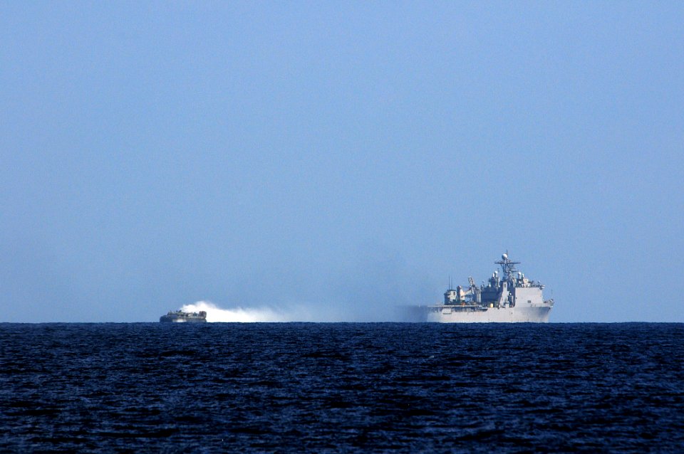 US Navy 110326-N-RC734-263 A landing craft air cushion (LCAC) departs the well deck aboard USS Comstock (LSD 45)