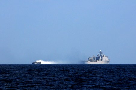 US Navy 110326-N-RC734-263 A landing craft air cushion (LCAC) departs the well deck aboard USS Comstock (LSD 45) photo