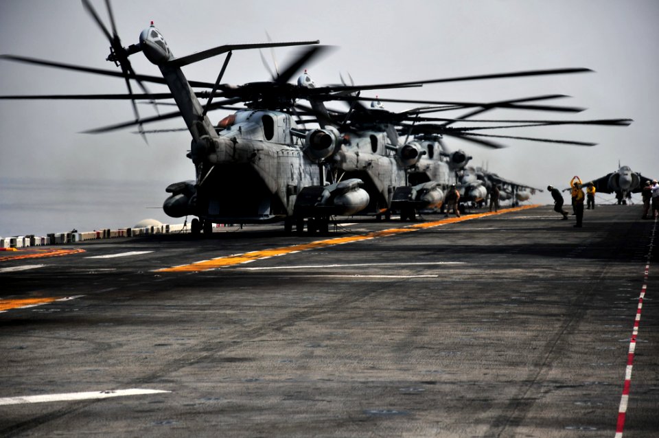 US Navy 110330-N-ZS029-400 CH-53E Sea Stallion helicopters start their rotors in preparation for takeoff from USS Boxer (LHD 4)