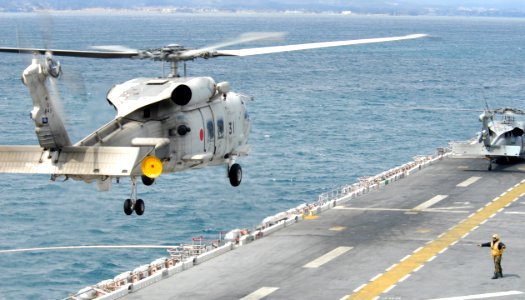 US Navy 110327-N-8607R-022 A Japan Maritime Self-Defense Force S-70B Sea Hawk helicopter lands abaord the forward-deployed amphibious assault ship