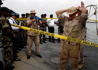 US Navy 110330-N-HI707-567 An Angolan visit, board, search and seizure team watches during an Africa Partnership Station tactics demonstration