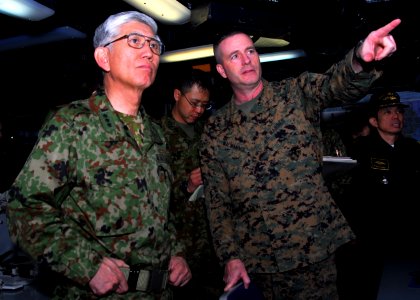 US Navy 110331-N-8607R-110 Col. Andrew MacMannis discusses humanitarian assistance operations with Lt. Gen. Eiji Kimizuka aboard USS Essex (LHD 2)