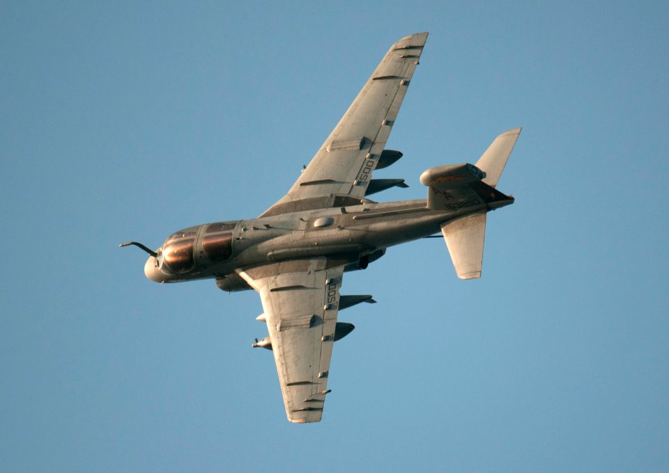 US Navy 110328-N-DR144-396 An EA-6B Prowler assigned to Electronic Attack Squadron (VAQ) 134 banks over the Nimitz-class aircraft carrier USS Carl