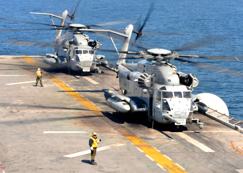 US Navy 110329-N-5538K-211 CH-53E Sea Stallion helicopters assigned to Marine Medium Helicopter Squadron (HMM) 262 prepare to take off from the for