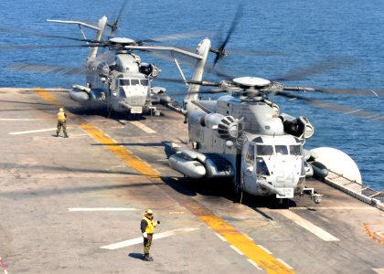 US Navy 110329-N-5538K-211 CH-53E Sea Stallion helicopters assigned to Marine Medium Helicopter Squadron (HMM) 262 prepare to take off from the for