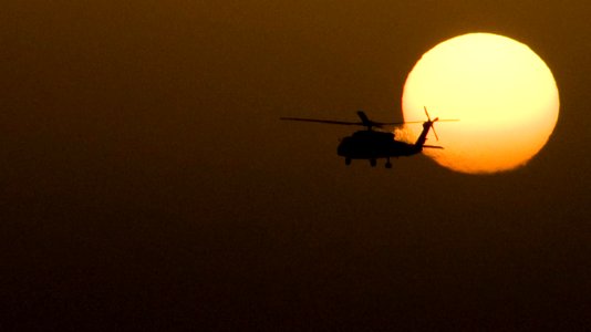 US Navy 110326-N-6505H-431 An HH-60H Sea Hawk helicopter assigned to Helicopter Anti-submarine Squadron (HS) 15 conducts plane guard duties for the photo