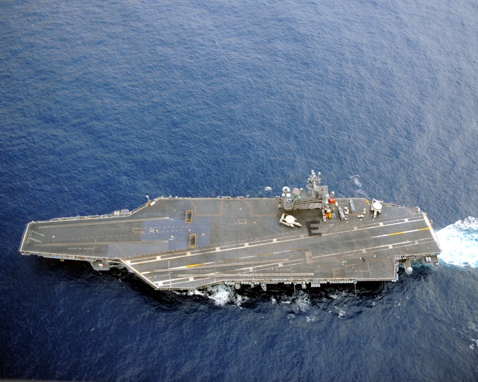 US Navy 110326-N-YZ751-125 Sailors assigned to the supply department of the aircraft carrier USS George H.W. Bush (CVN 77) form the letter E on the